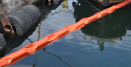 cover for an article about Protecting Our Waters with Robust Solid Flotation Booms